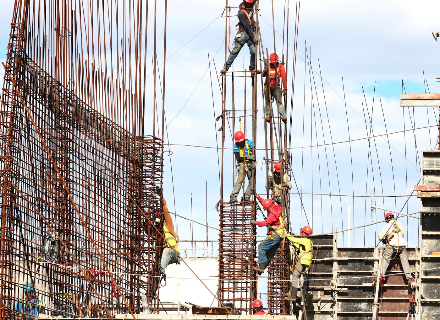 Steel fixers tying reinforcement on site